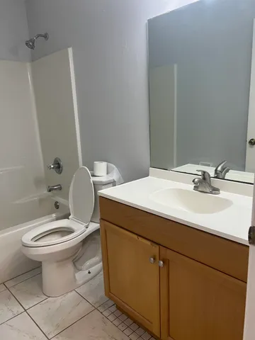 a bathroom with a toilet a sink and a bathtub