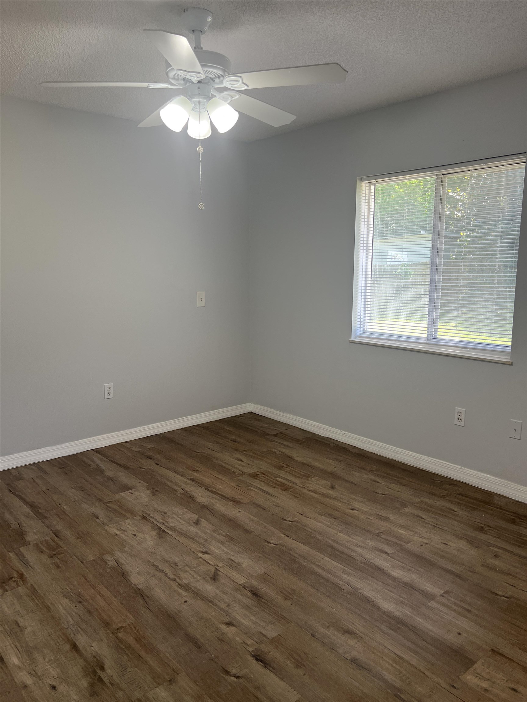 5465 Datil Pepper Road St. Augustine, FL 32086 - Photo 18 of 28 a view of an empty room with wooden floor and a window