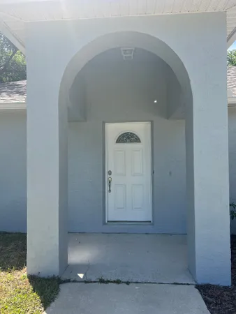 a view of a hallway with a window