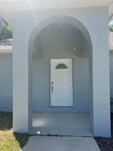 a view of a hallway with a window