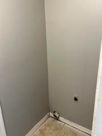 a view of a small space with wooden floor