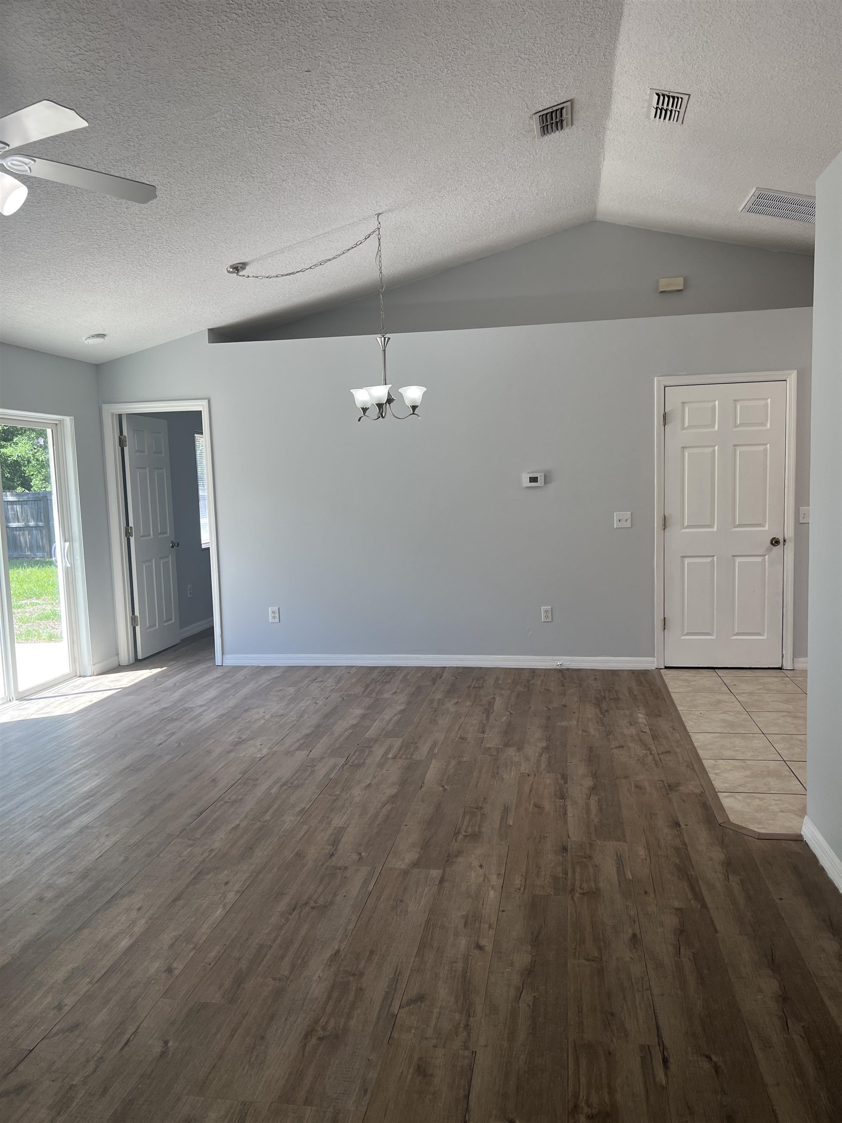 5465 Datil Pepper Road St. Augustine, FL 32086 - Photo 25 of 28 an empty room with wooden floor and windows
