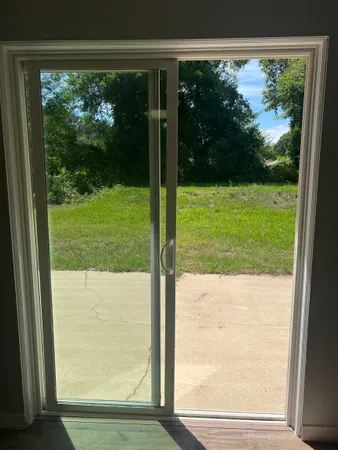 a view of backyard with green space