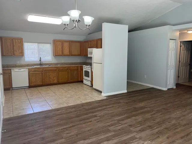 a view of a kitchen with microwave and cabinets