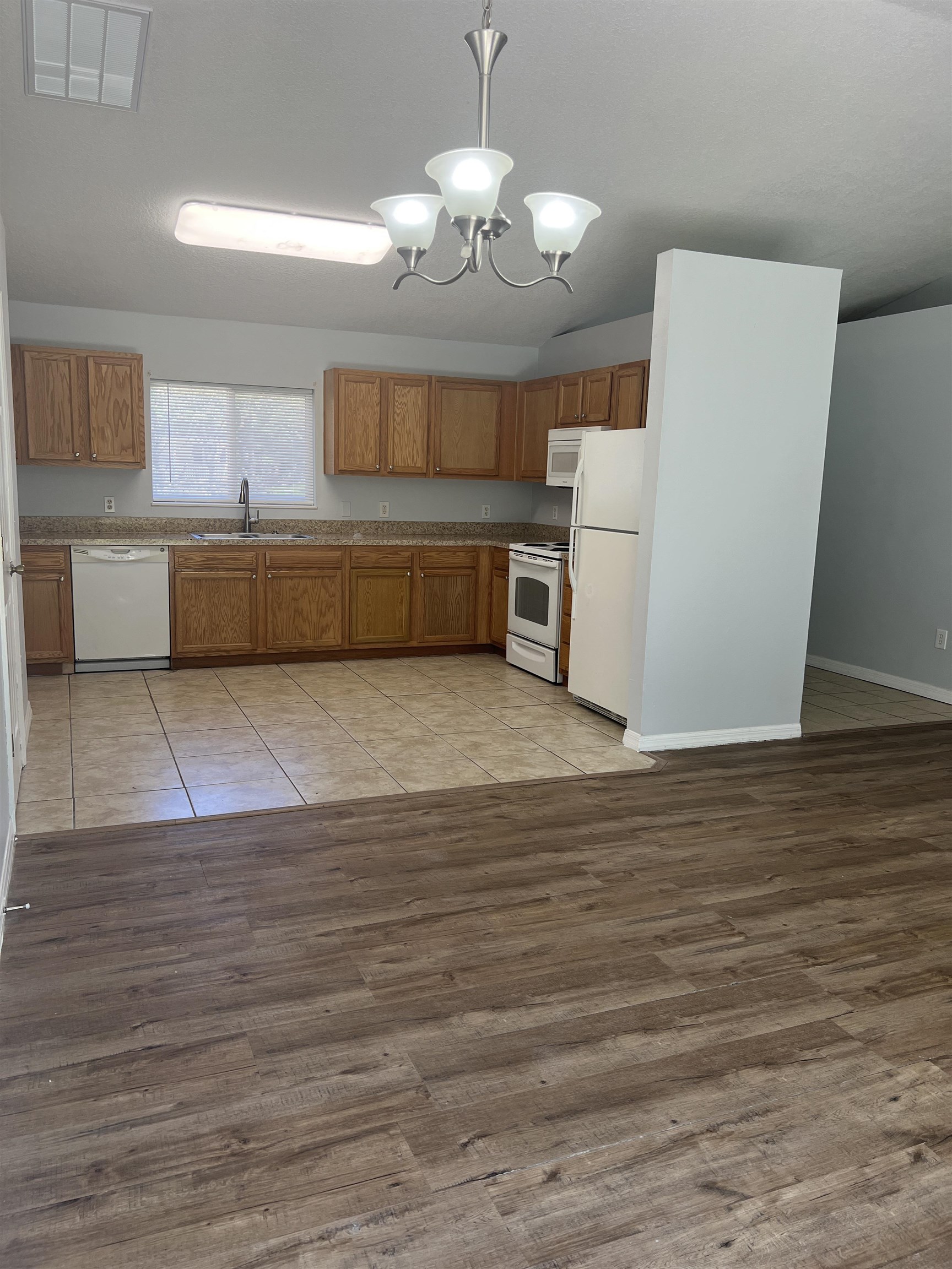 5465 Datil Pepper Road St. Augustine, FL 32086 - Photo 7 of 28 a view of a kitchen with microwave and cabinets