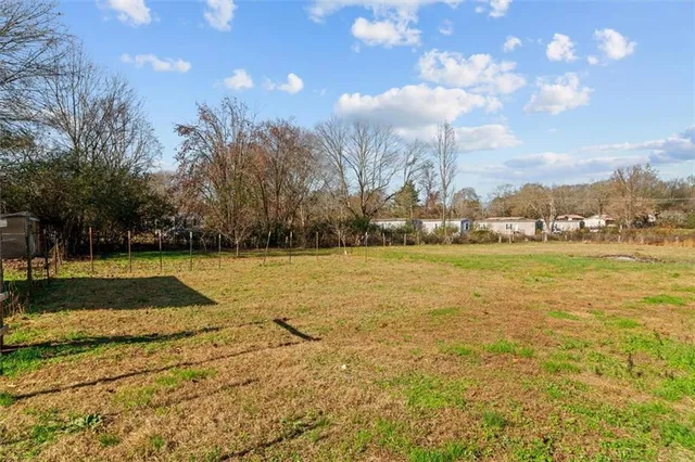 a view of pool of the house with a yard