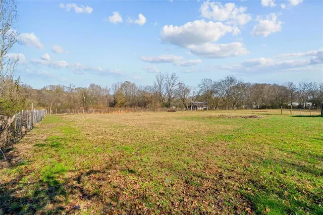 a view of a lake with houses in the back