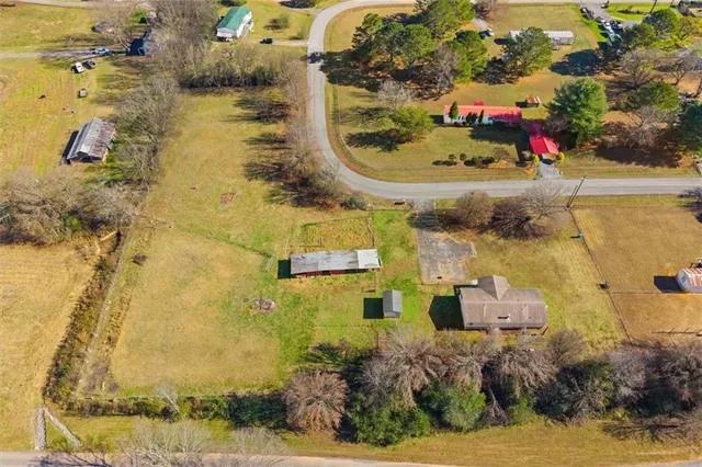 an aerial view of residential houses with outdoor space