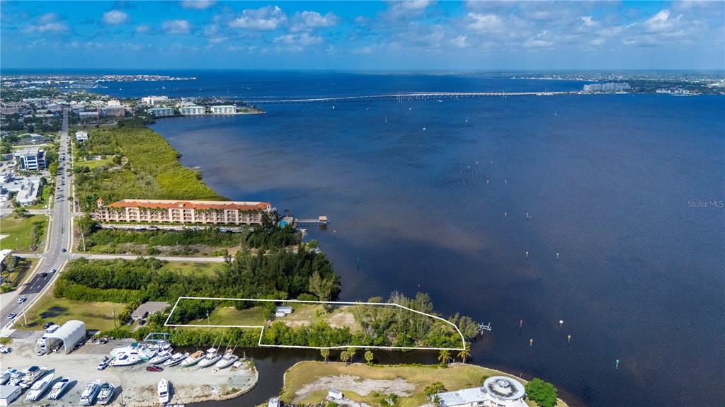 6141 Elliott Street Punta Gorda, FL 33950 - Photo 9 of 11 a view of a lake with a wall