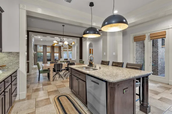 a kitchen with a table and chairs