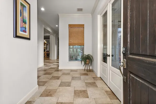 a view of a hallway with windows and couch
