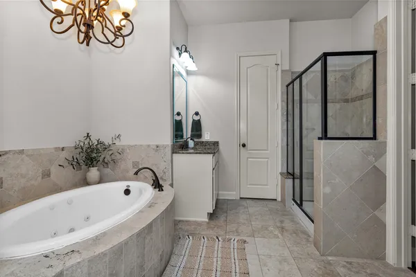 a bathroom with a bathtub and a shower