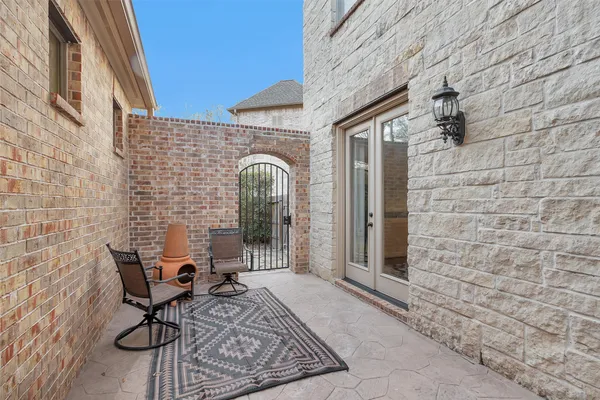 a view of a chairs and table in a patio
