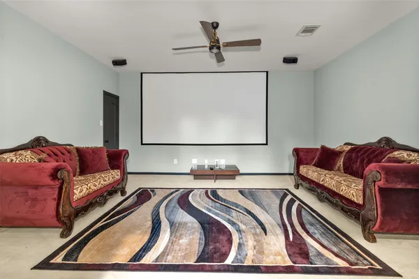 a living room with couches and a flat screen tv