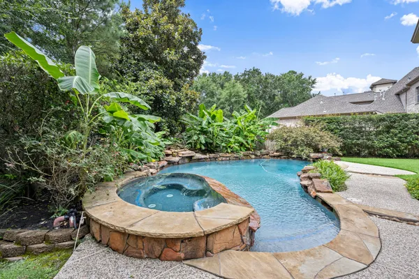 a view of a swimming pool with back yard