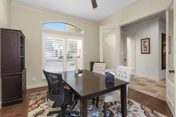 a view of a dining room with furniture and a window