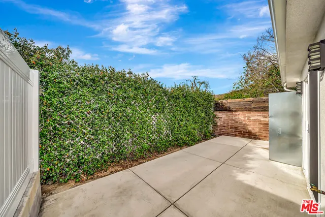a view of a pathway both side of a yard