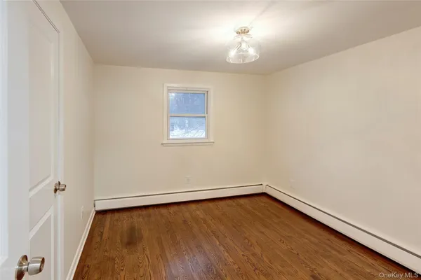an empty room with a hardwood and hardwood floor