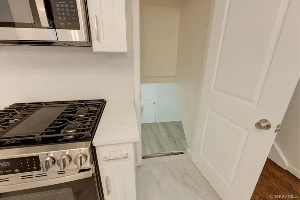 a kitchen with a stove and a microwave