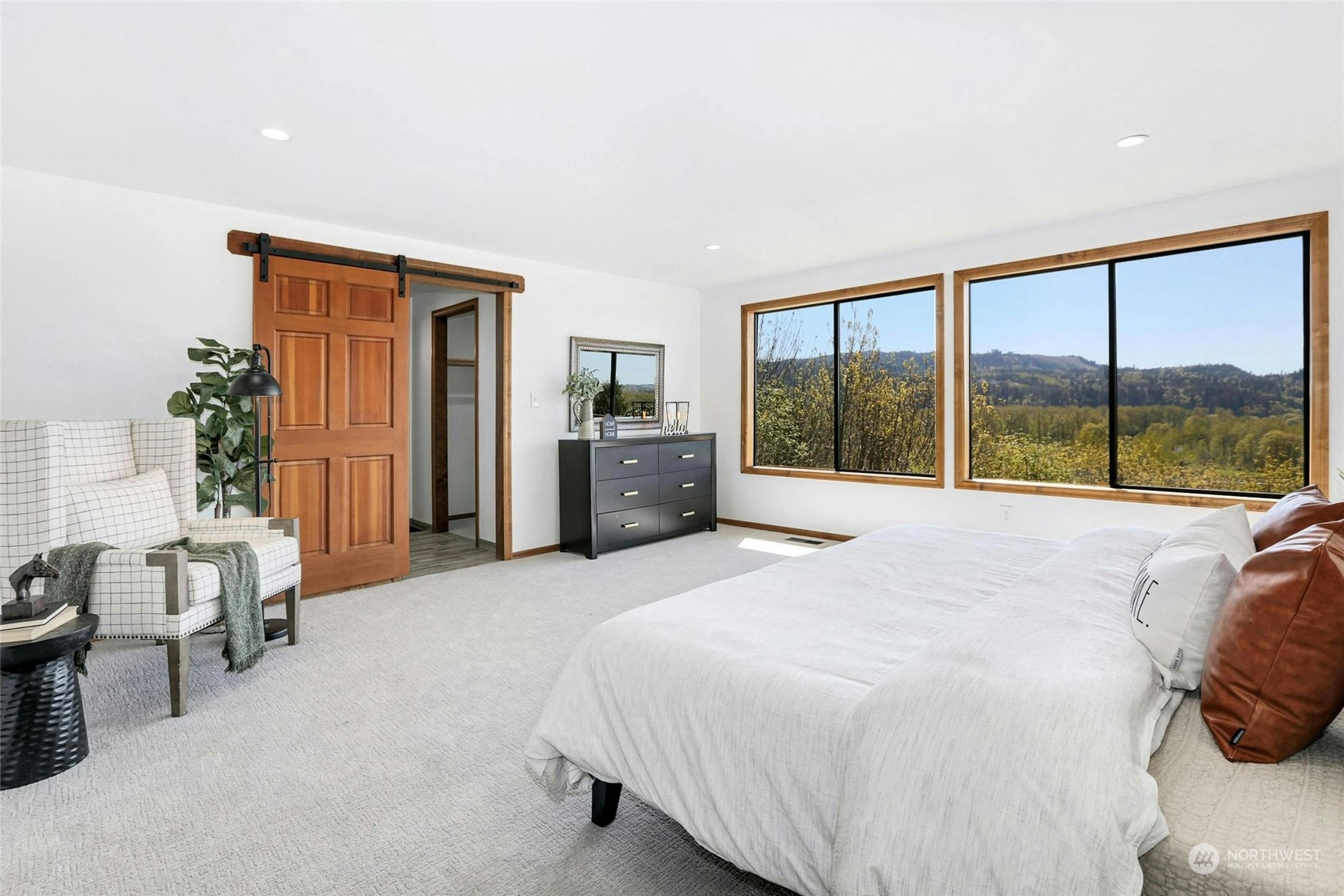21500 Calhoun Road Monroe, WA 98272 - Photo 9 of 20 a bedroom with a large bed and a large window