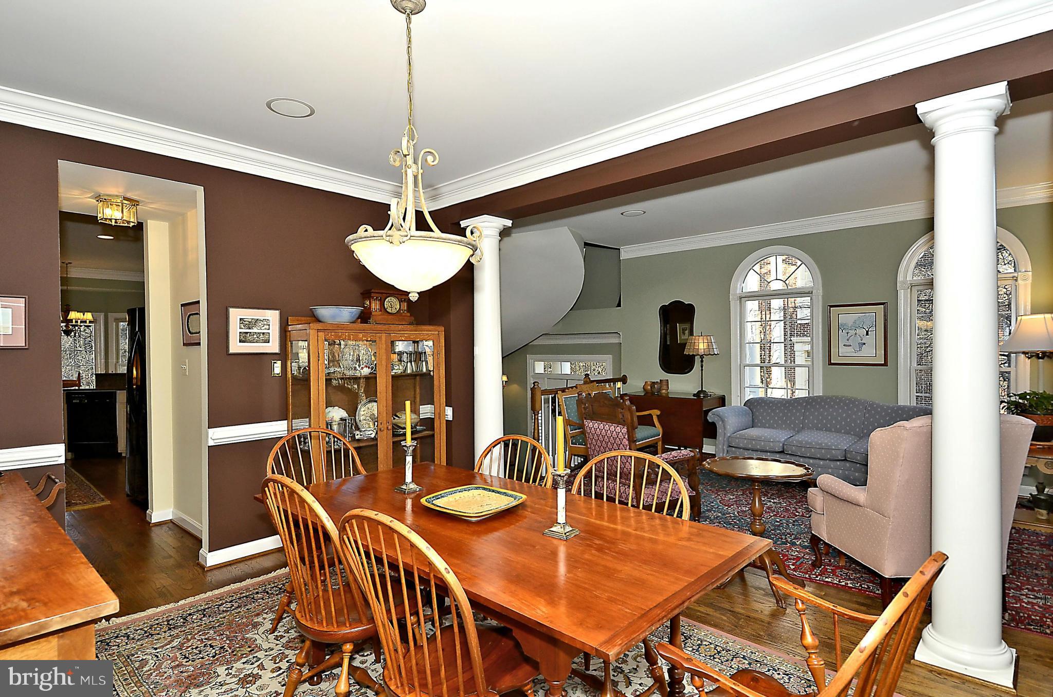 148 Rees Place Falls Church, VA 22046 - Photo 13 of 29 a dining room with furniture a chandelier and wooden floor