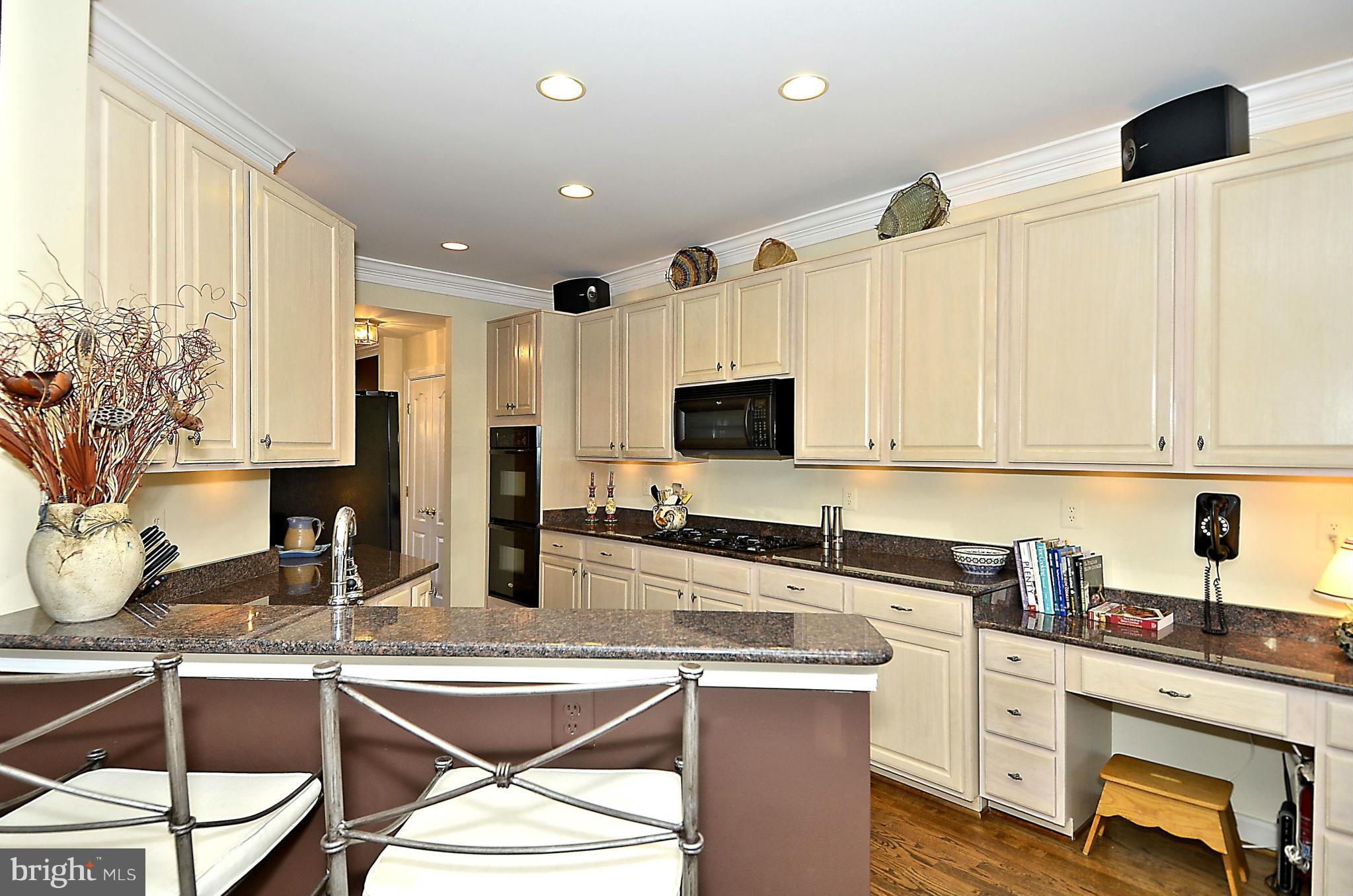 148 Rees Place Falls Church, VA 22046 - Photo 15 of 29 a kitchen with stainless steel appliances granite countertop a sink and cabinets