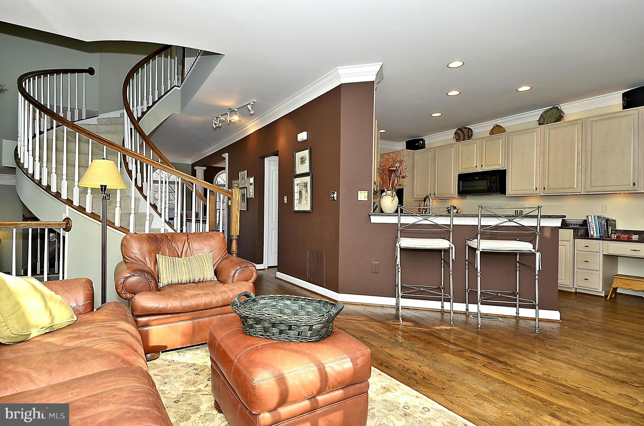 148 Rees Place Falls Church, VA 22046 - Photo 17 of 29 a living room with furniture and a kitchen view