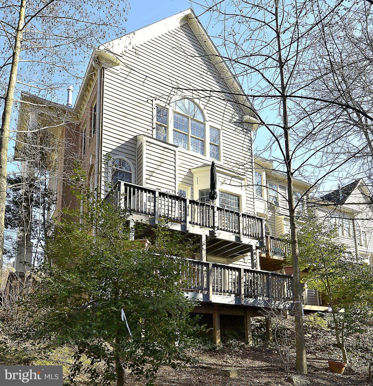 148 Rees Place Falls Church, VA 22046 - Photo 3 of 29 a view of a house with a small yard and large tree