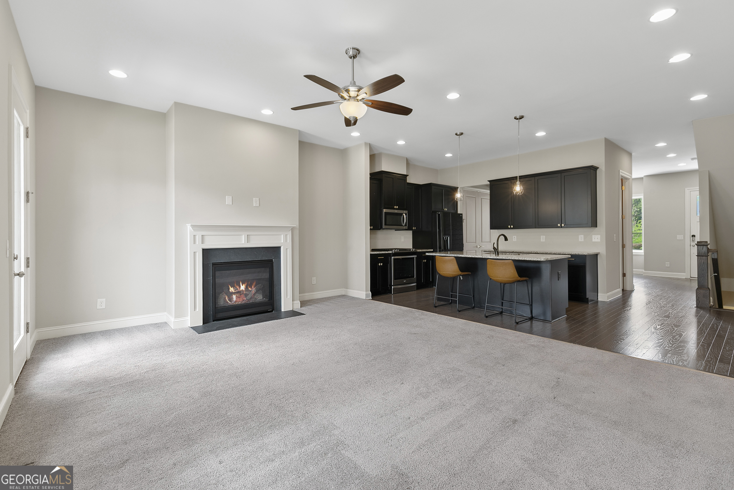 1954 Summit Trace Circle Northwest Atlanta, GA 30318 - Photo 12 of 45 a view of a livingroom with fireplace and a kitchen