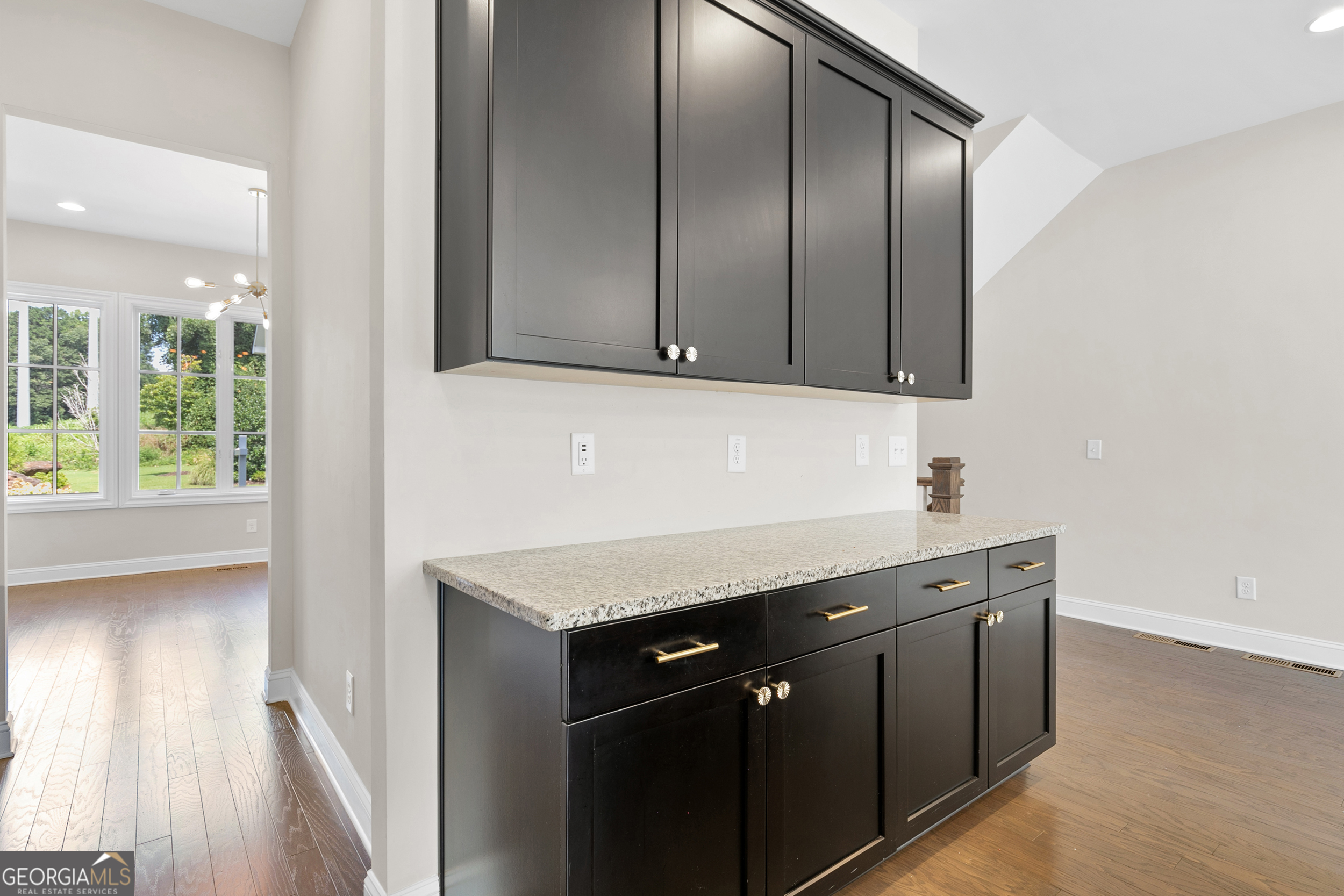 1954 Summit Trace Circle Northwest Atlanta, GA 30318 - Photo 13 of 45 a kitchen with stainless steel appliances granite countertop a sink and a stove with wooden floor