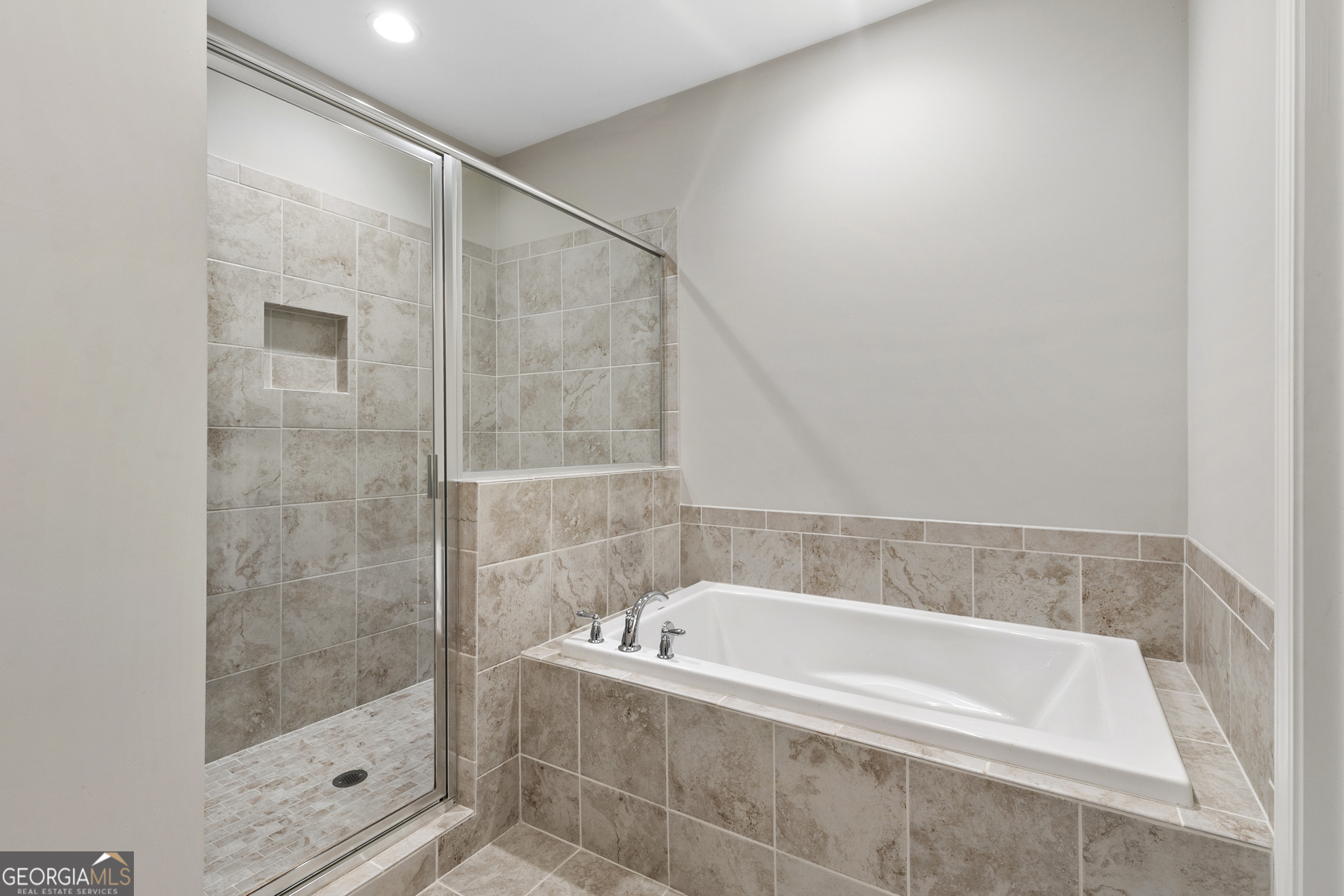 1954 Summit Trace Circle Northwest Atlanta, GA 30318 - Photo 24 of 45 a bathroom with a bathtub and shower