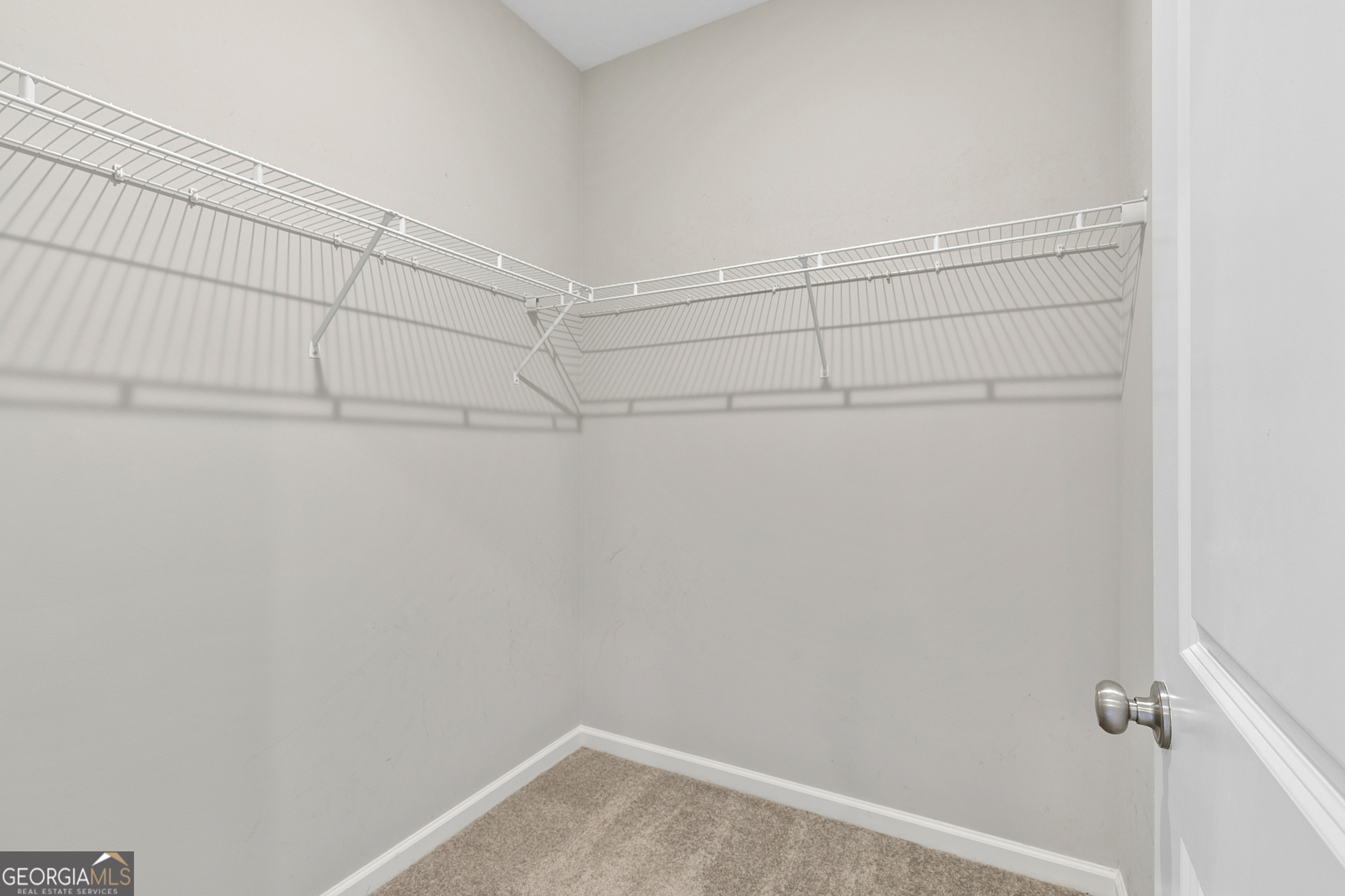 1954 Summit Trace Circle Northwest Atlanta, GA 30318 - Photo 25 of 45 a view of a room with racks on the wall