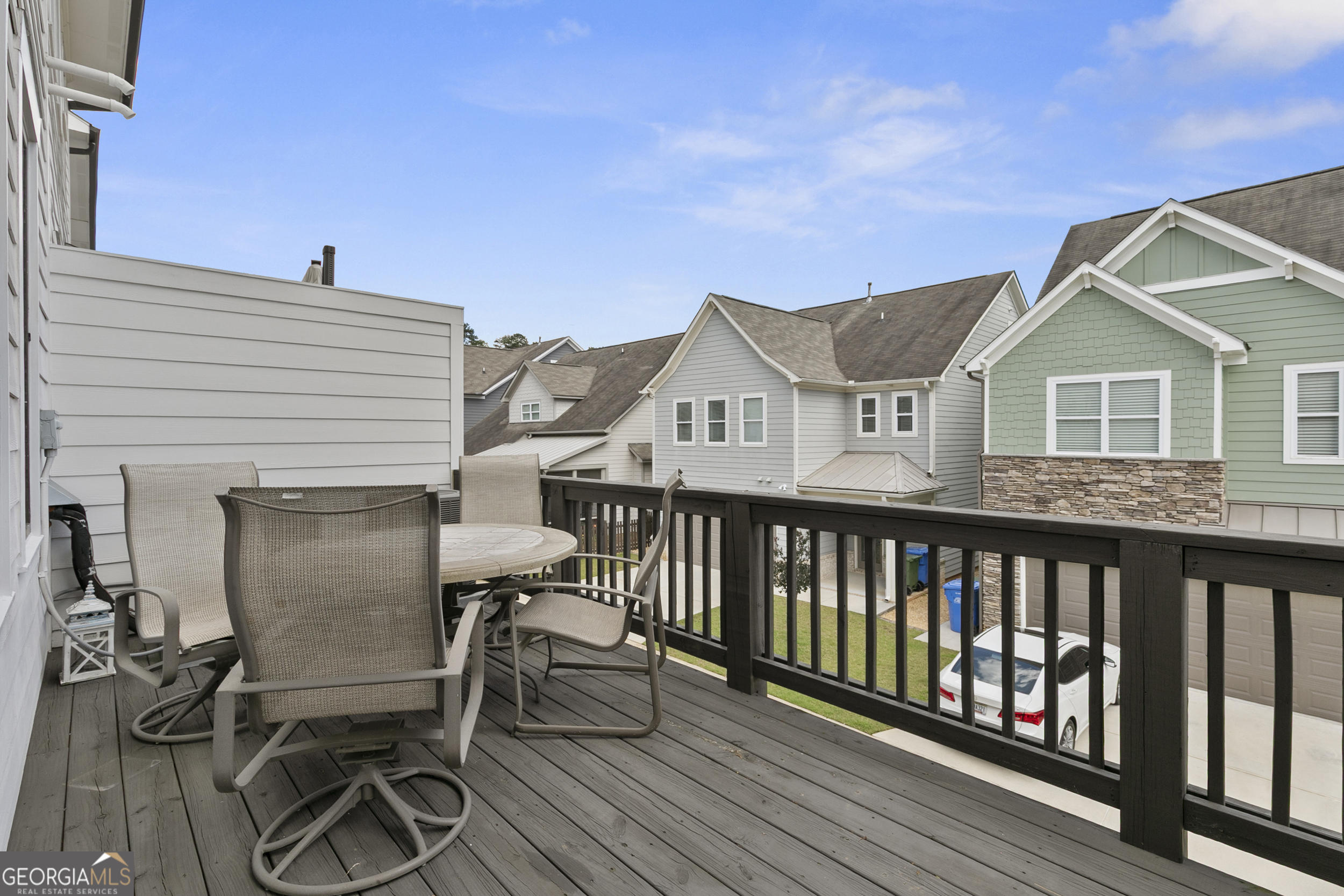 1954 Summit Trace Circle Northwest Atlanta, GA 30318 - Photo 36 of 45 a view of a house with wooden deck and furniture