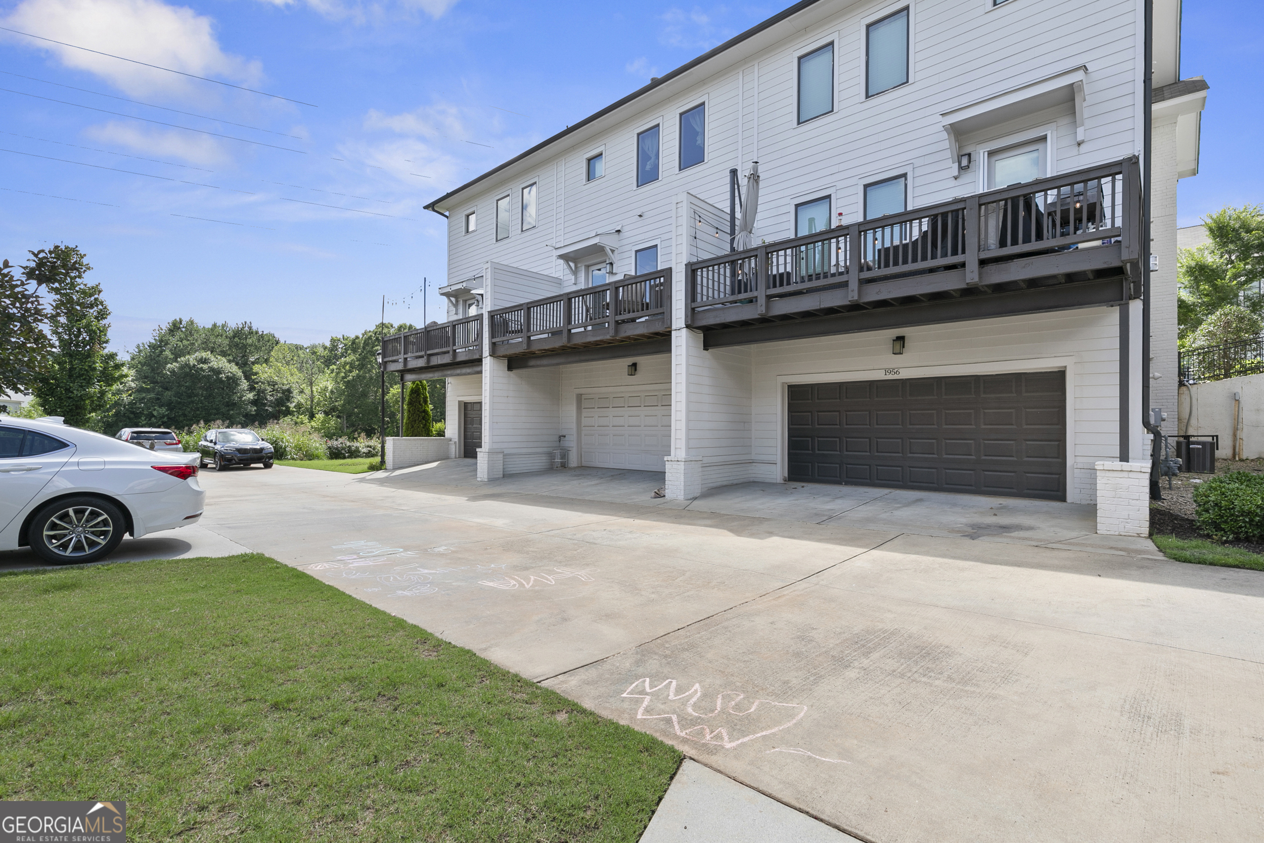 1954 Summit Trace Circle Northwest Atlanta, GA 30318 - Photo 37 of 45 a view of a house with a yard and parking space