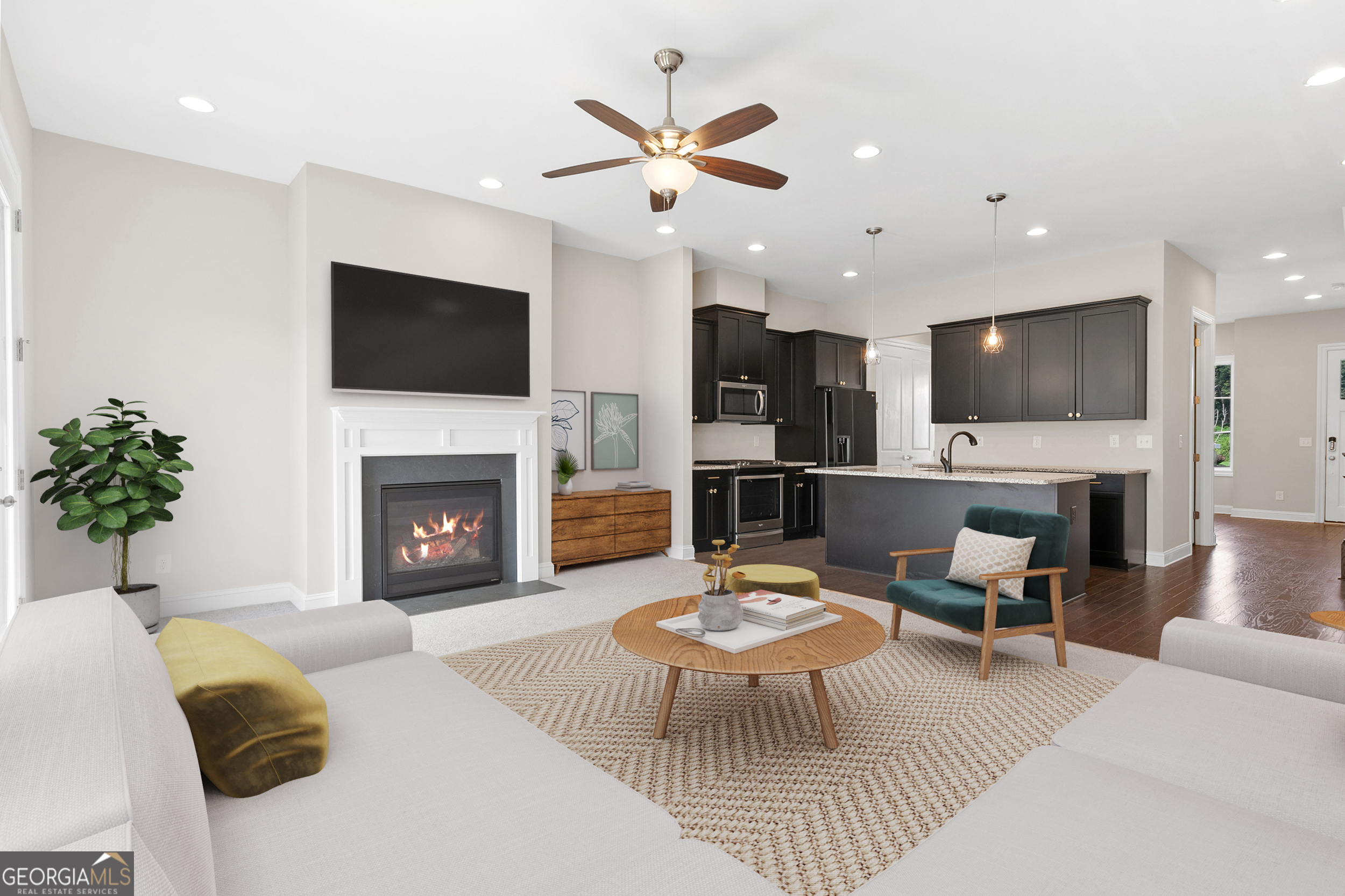 1954 Summit Trace Circle Northwest Atlanta, GA 30318 - Photo 5 of 45 a living room with furniture a fireplace and a flat screen tv