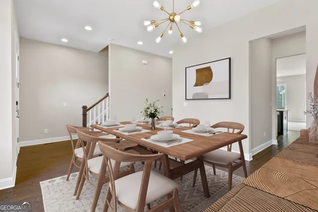 a view of a dining room with furniture and wooden floor