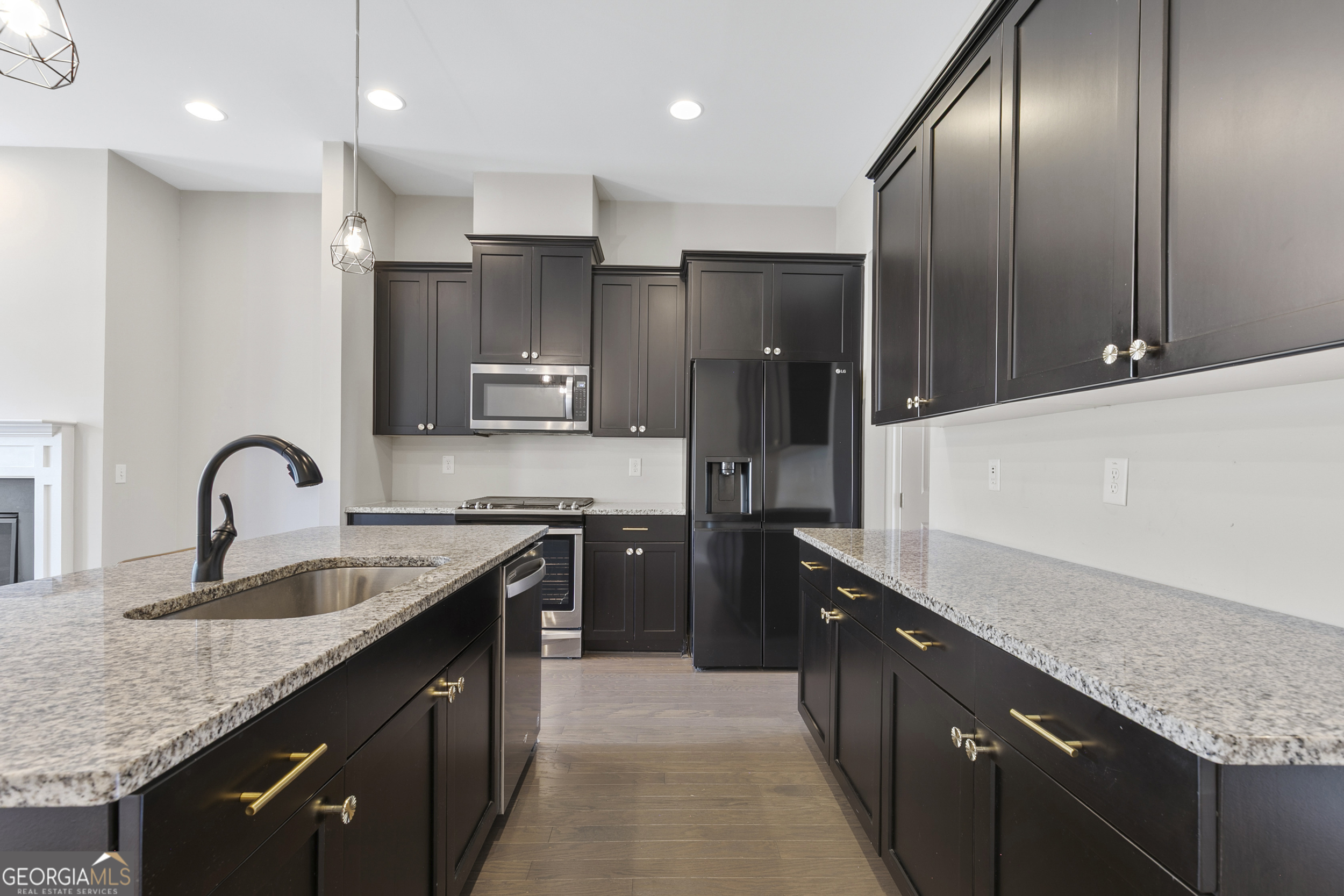 1954 Summit Trace Circle Northwest Atlanta, GA 30318 - Photo 9 of 45 a kitchen with granite countertop stainless steel appliances a sink stove top oven and refrigerator