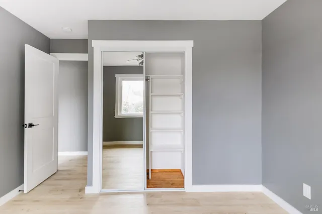 a view of an empty room with a window