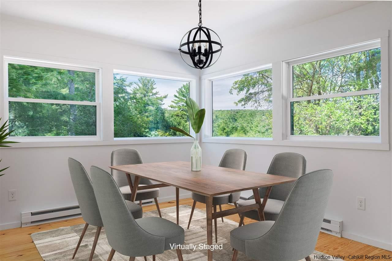 5646 Red Hill Road Claryville, NY 12725 - Photo 11 of 35 a view of a dining room with furniture window and outside view