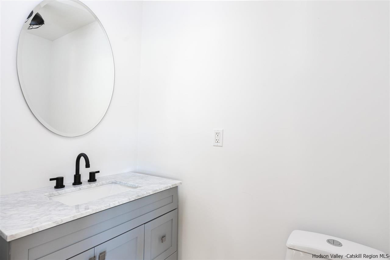 5646 Red Hill Road Claryville, NY 12725 - Photo 15 of 35 a bathroom with a sink and a mirror