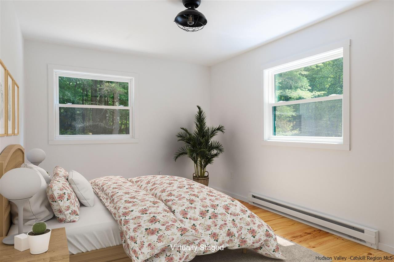 5646 Red Hill Road Claryville, NY 12725 - Photo 16 of 35 a bedroom with bed and a window