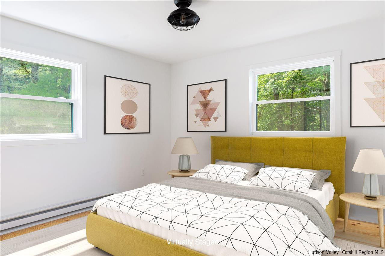 5646 Red Hill Road Claryville, NY 12725 - Photo 18 of 35 a bedroom with a bed and a window