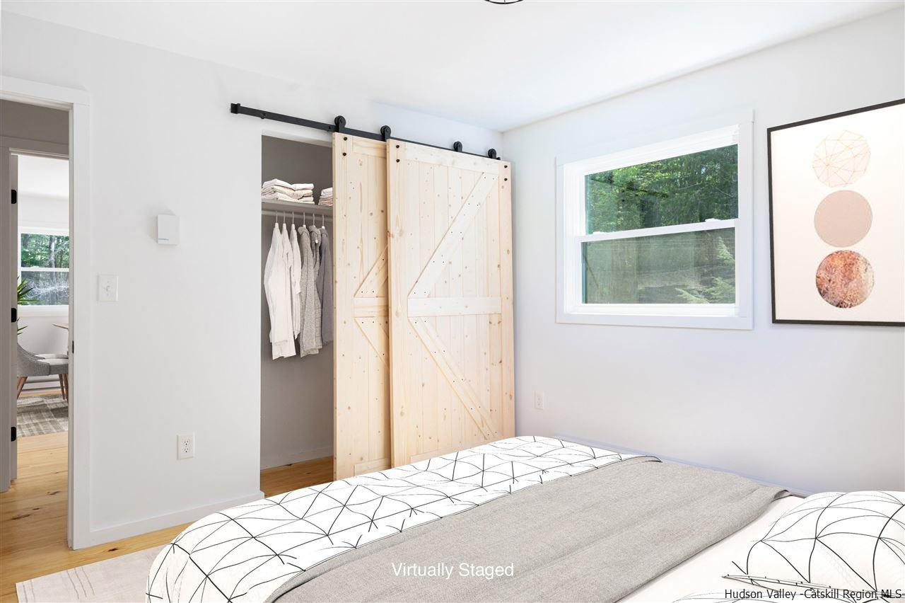 5646 Red Hill Road Claryville, NY 12725 - Photo 19 of 35 a bedroom with a bed and a window
