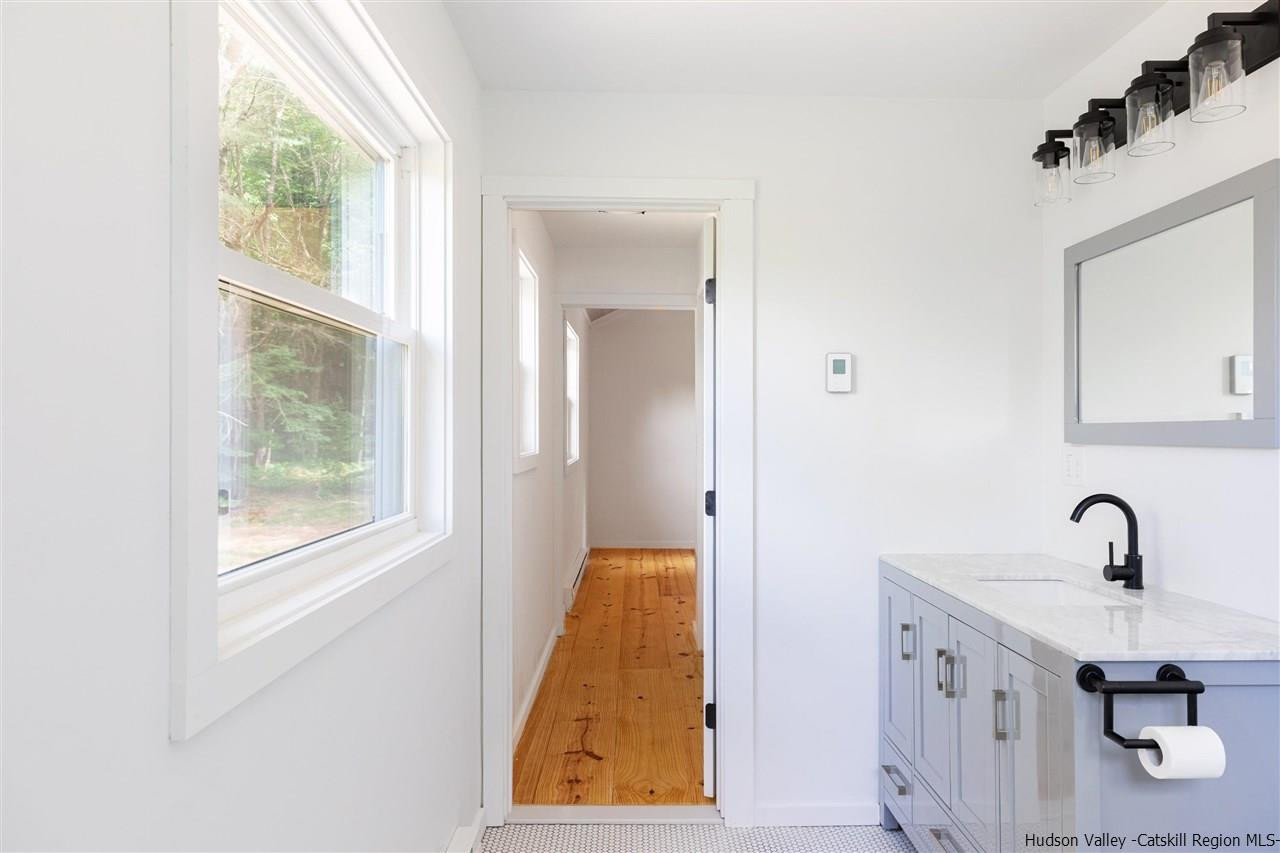 5646 Red Hill Road Claryville, NY 12725 - Photo 24 of 35 a bathroom with a sink and a window