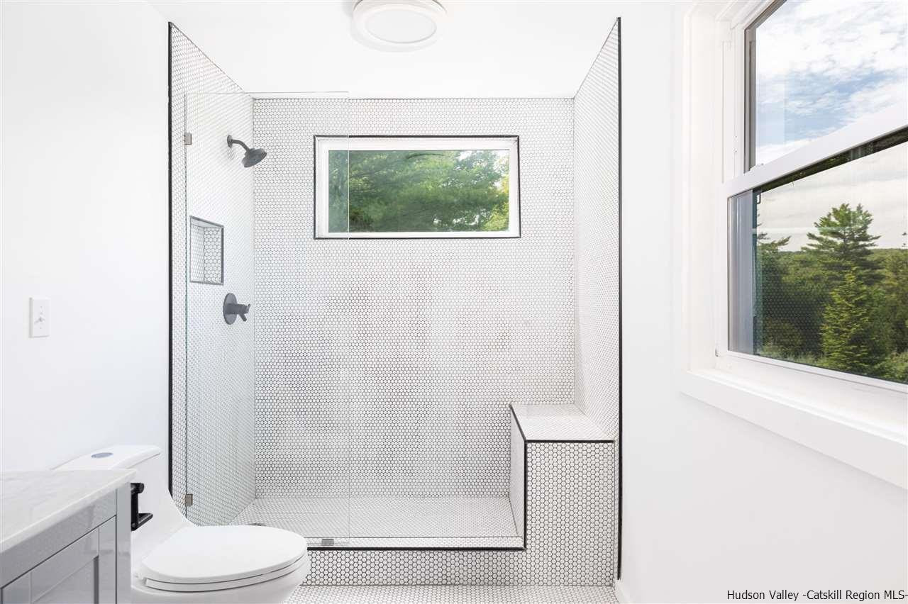 5646 Red Hill Road Claryville, NY 12725 - Photo 25 of 35 a bathroom with a toilet and a shower