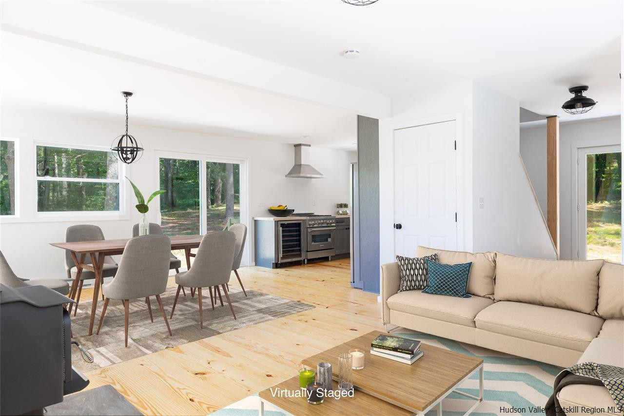 5646 Red Hill Road Claryville, NY 12725 - Photo 7 of 35 a living room with furniture kitchen view and a large window