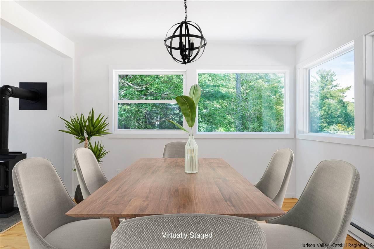 5646 Red Hill Road Claryville, NY 12725 - Photo 10 of 35 a view of a dining room with furniture window and outside view