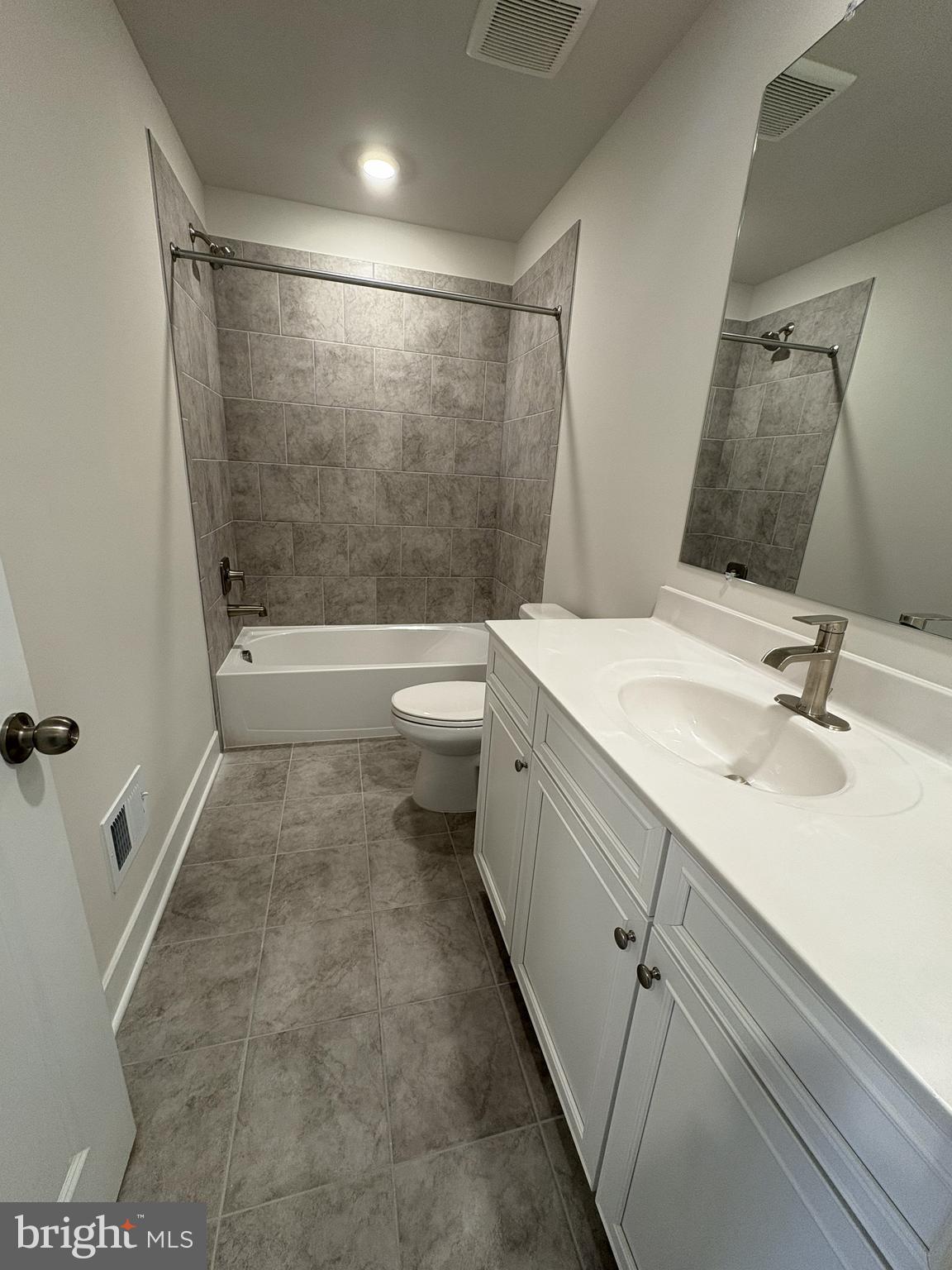 7450 Cornerstone Way Laurel, MD 20707 - Photo 14 of 14 a bathroom with a sink a toilet and shower