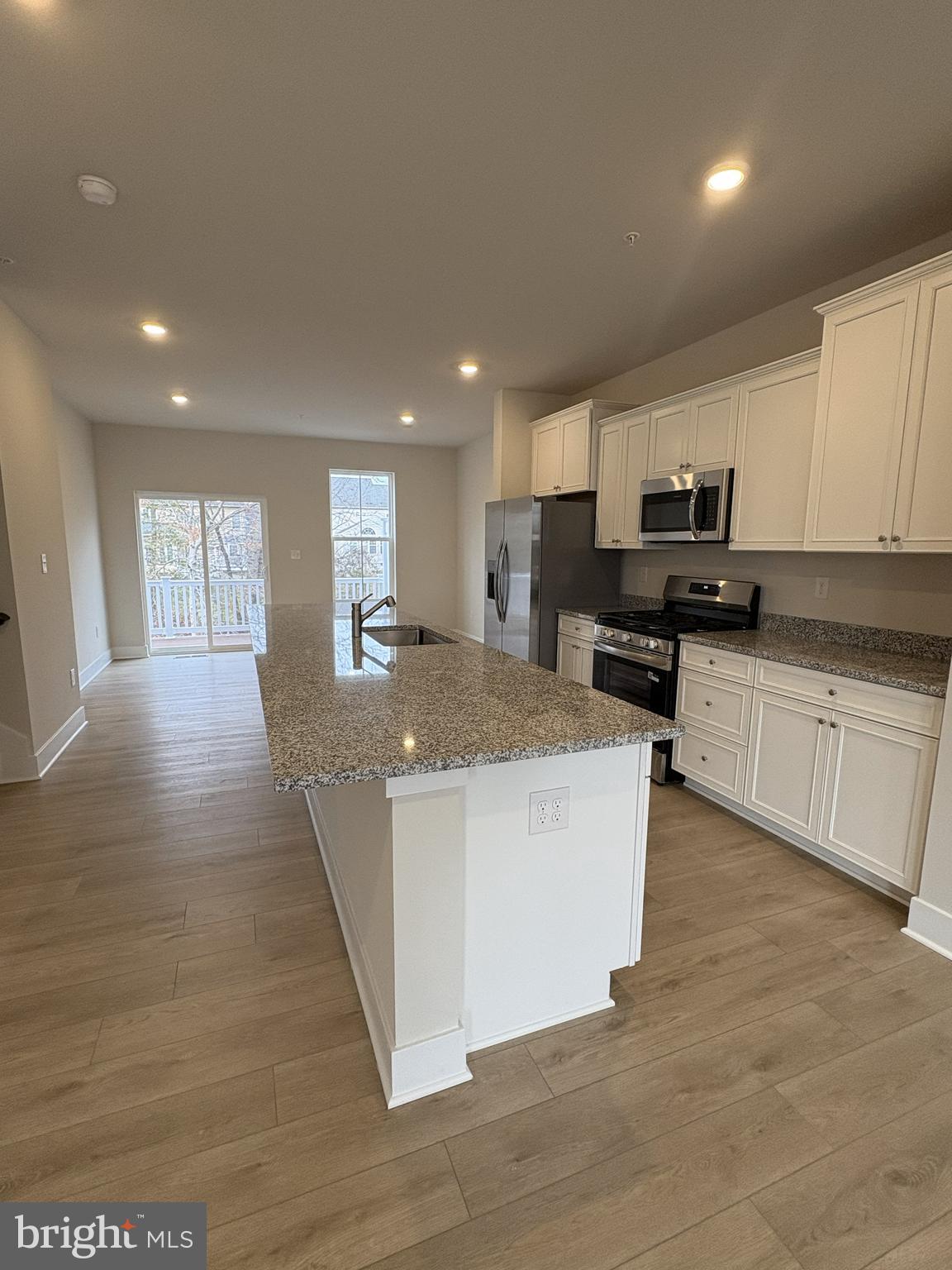 7450 Cornerstone Way Laurel, MD 20707 - Photo 3 of 14 a large kitchen with stainless steel appliances granite countertop a large counter top and a stove top oven