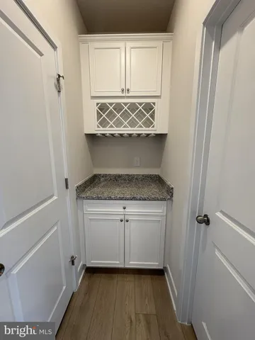 a living room with a stove and a mirror